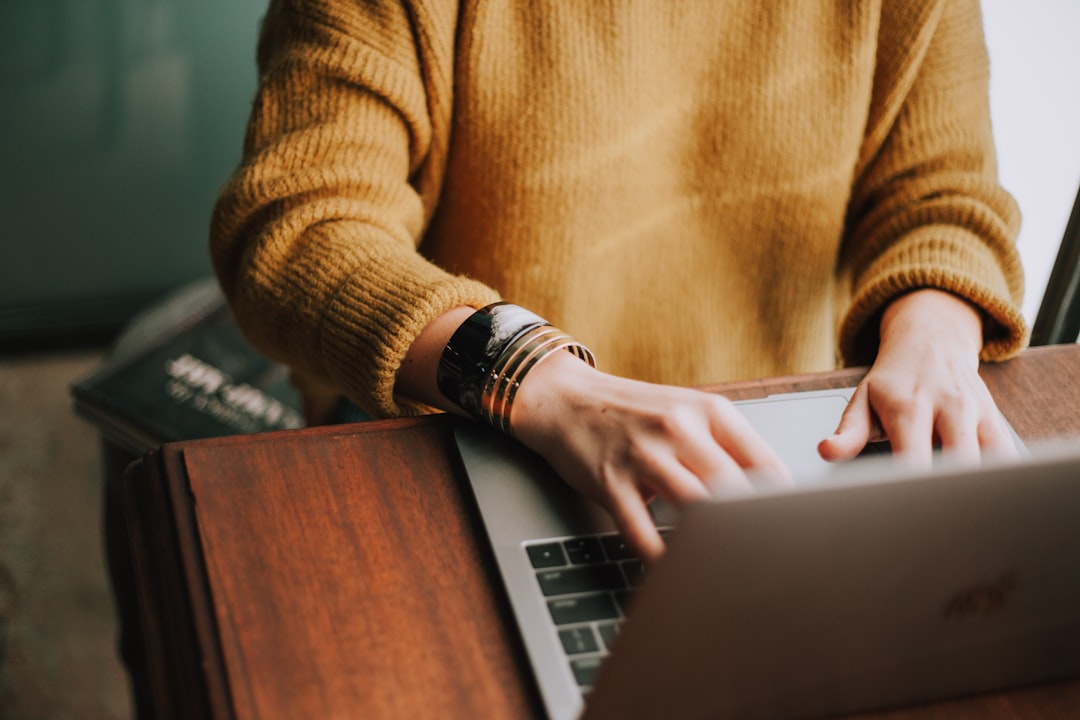 Person using laptop computer for workflow representing blog traffic growth planning