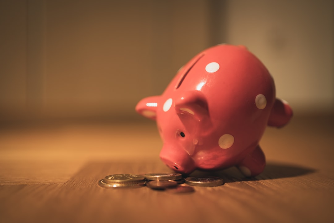Piggy bank with coins representing savings when choosing free vs paid hosting