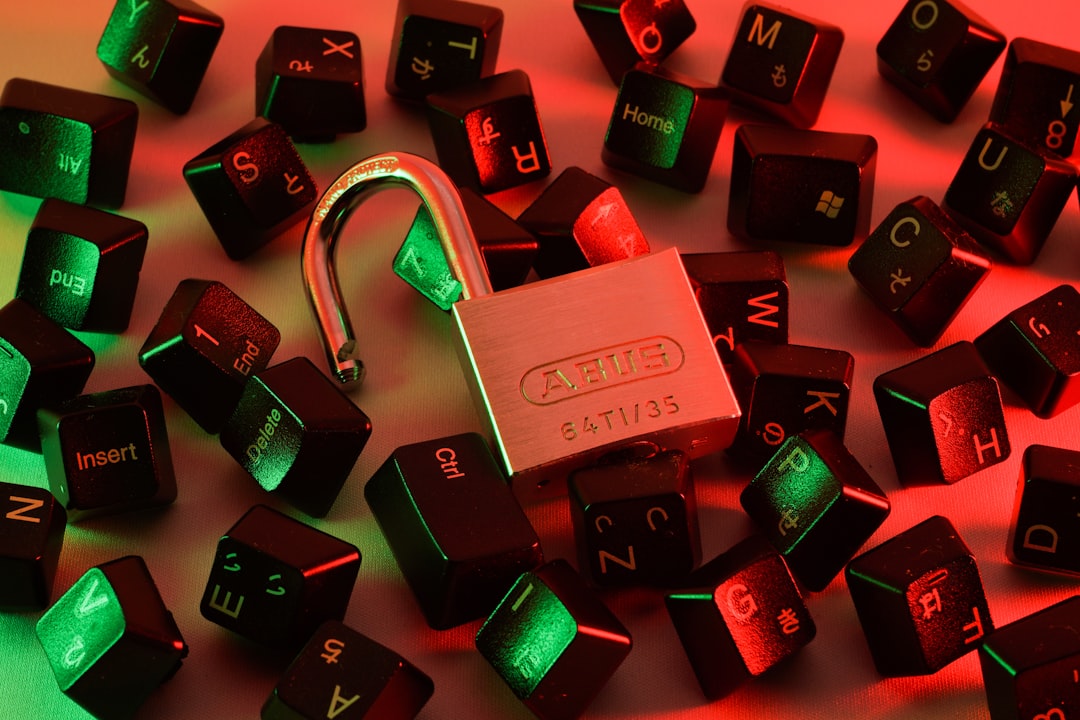 Open padlock with scattered keyboard keys representing malware and hacking risks