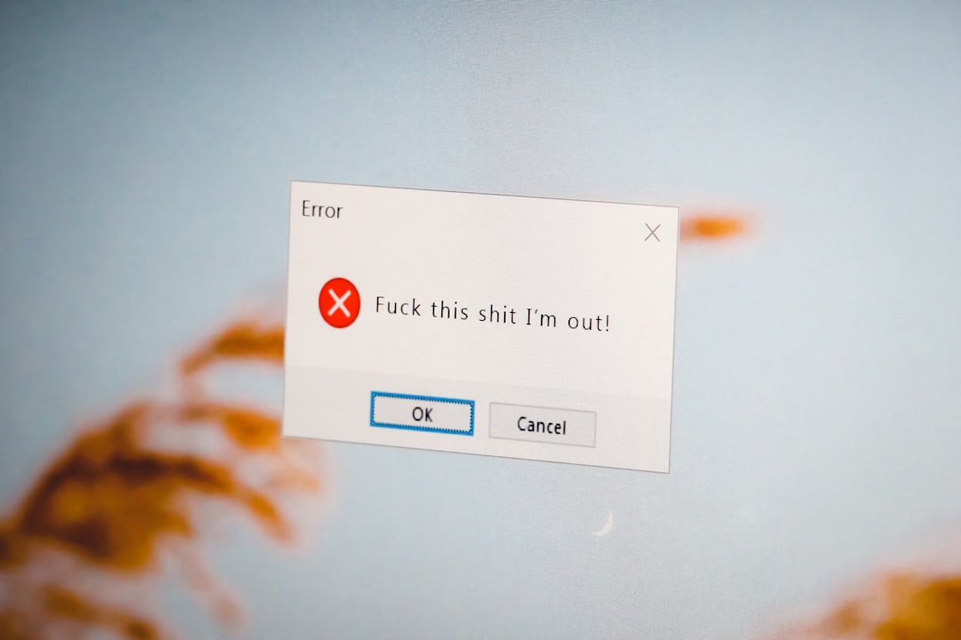 Close-up computer screen with a warning sign representing website security warnings
