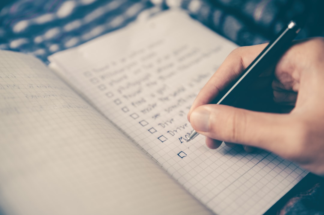 Checklist on notebook representing website maintenance tasks