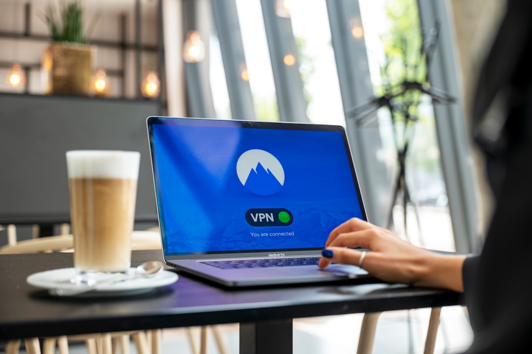 Person working on laptop representing VPS hosting management