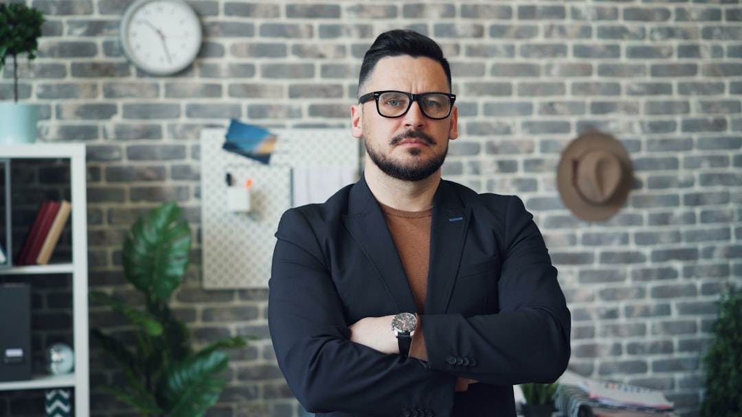 Serious professional man in office representing evaluating a reseller hosting business model