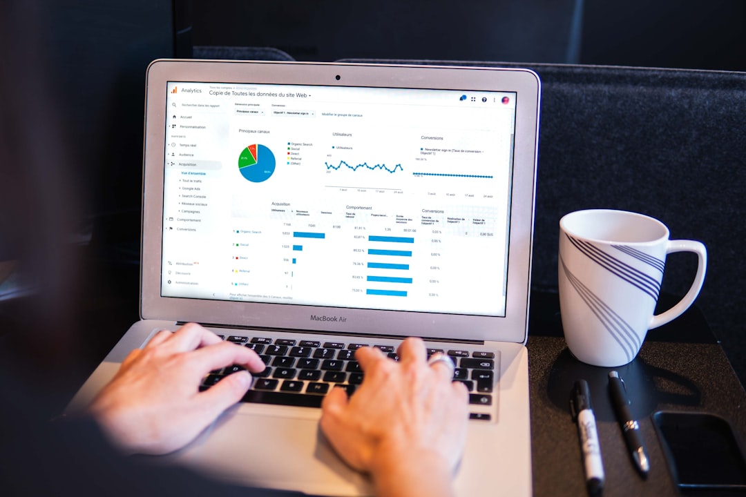 Person using laptop to view Google Analytics overview report after a hosting migration