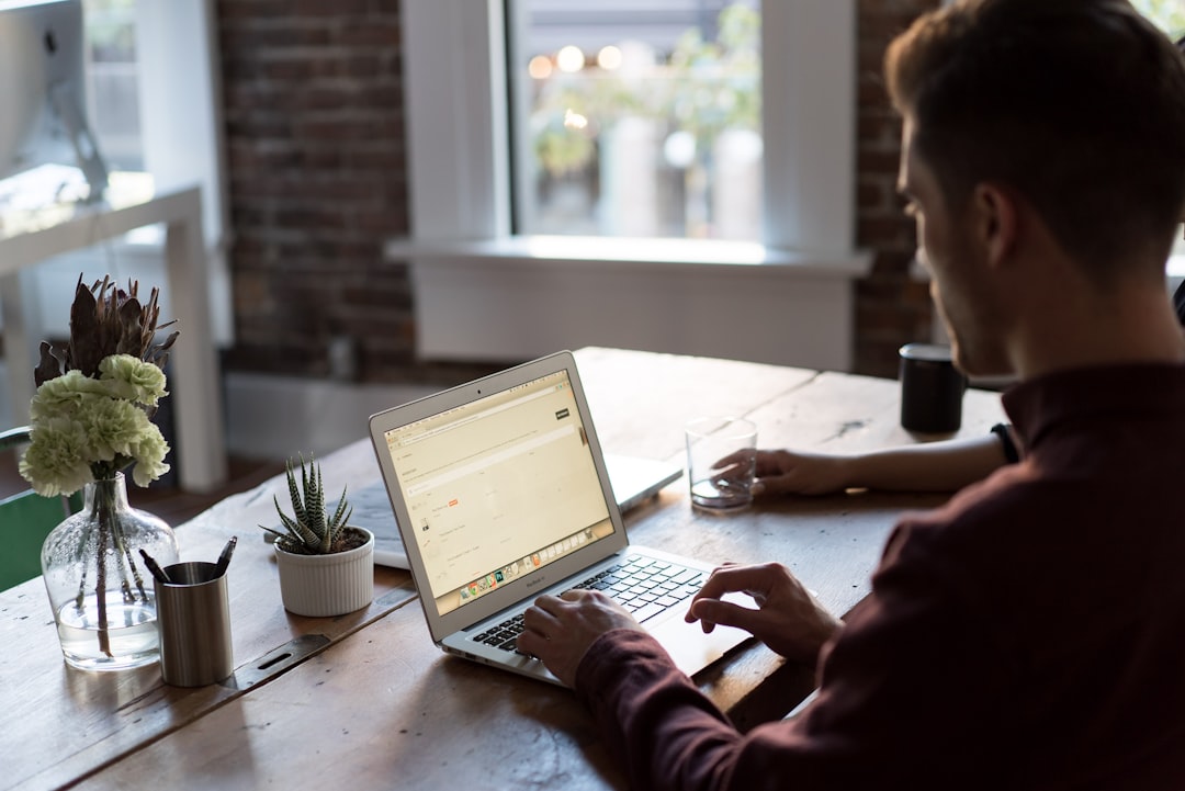 Small business owner managing their WordPress website on a laptop