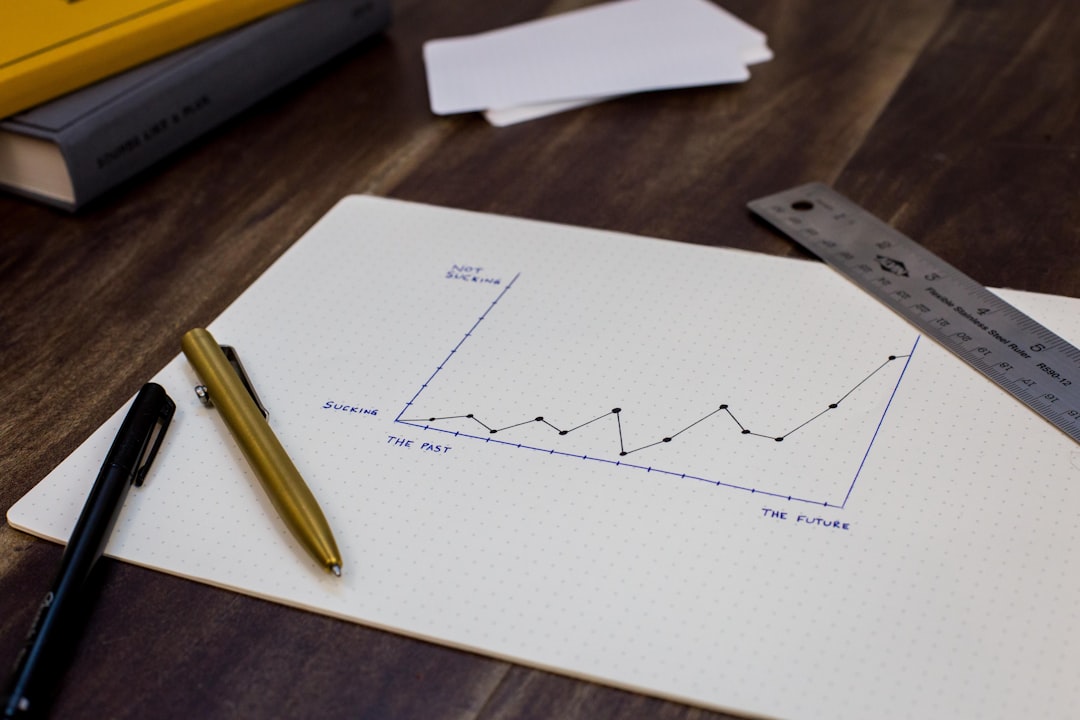 Pen on paper charting business goals representing startup growth planning