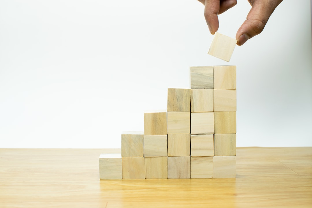 Business growth pyramid blocks representing scaling startup hosting infrastructure