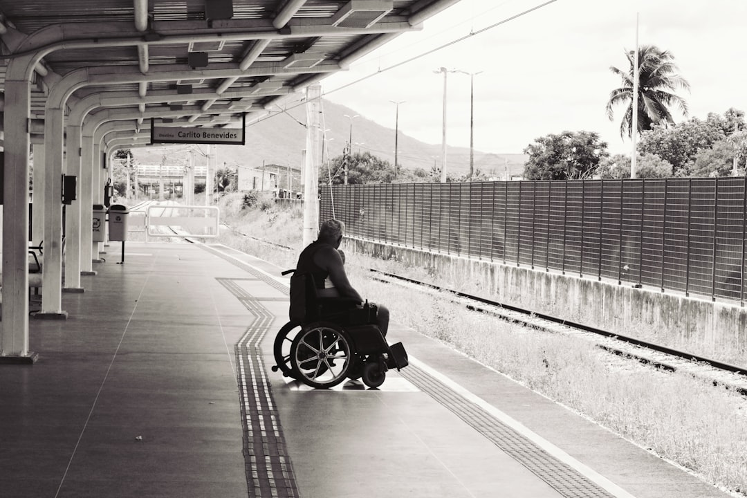 Grayscale photo of person in wheelchair representing web accessibility awareness